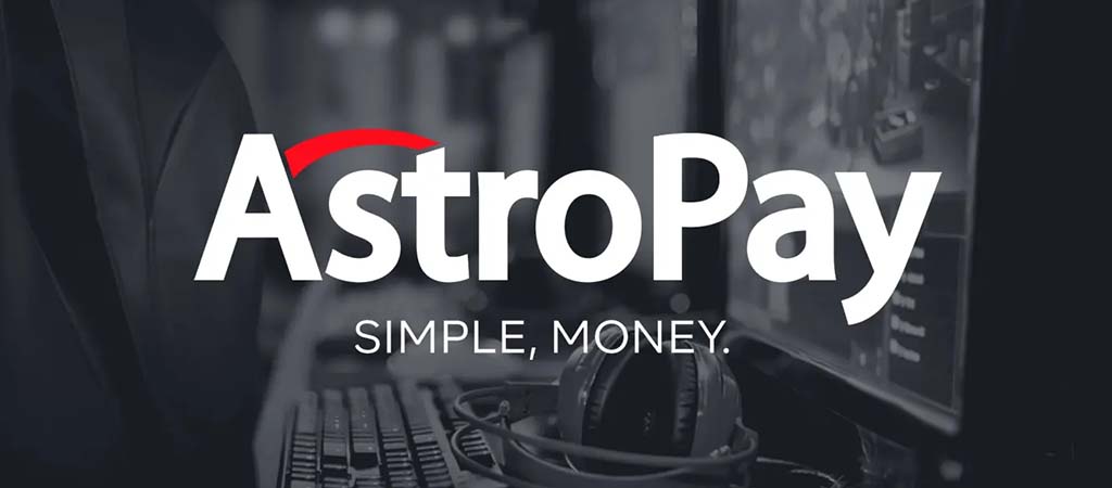 AstroPay logó, fekete-fehér, gaming felszerelés, fülhallgató, billentyűzet, egyszerű pénzkezelés, szlogen, digitális fizetés